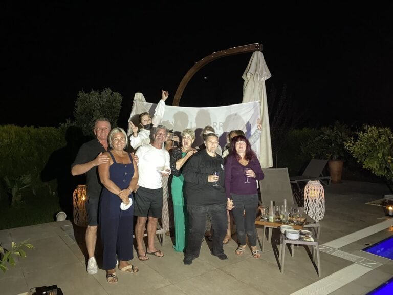 Guests celebrating together in the garden at night