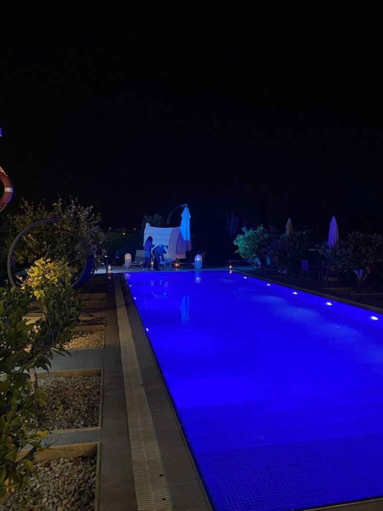 The pool lit up at night