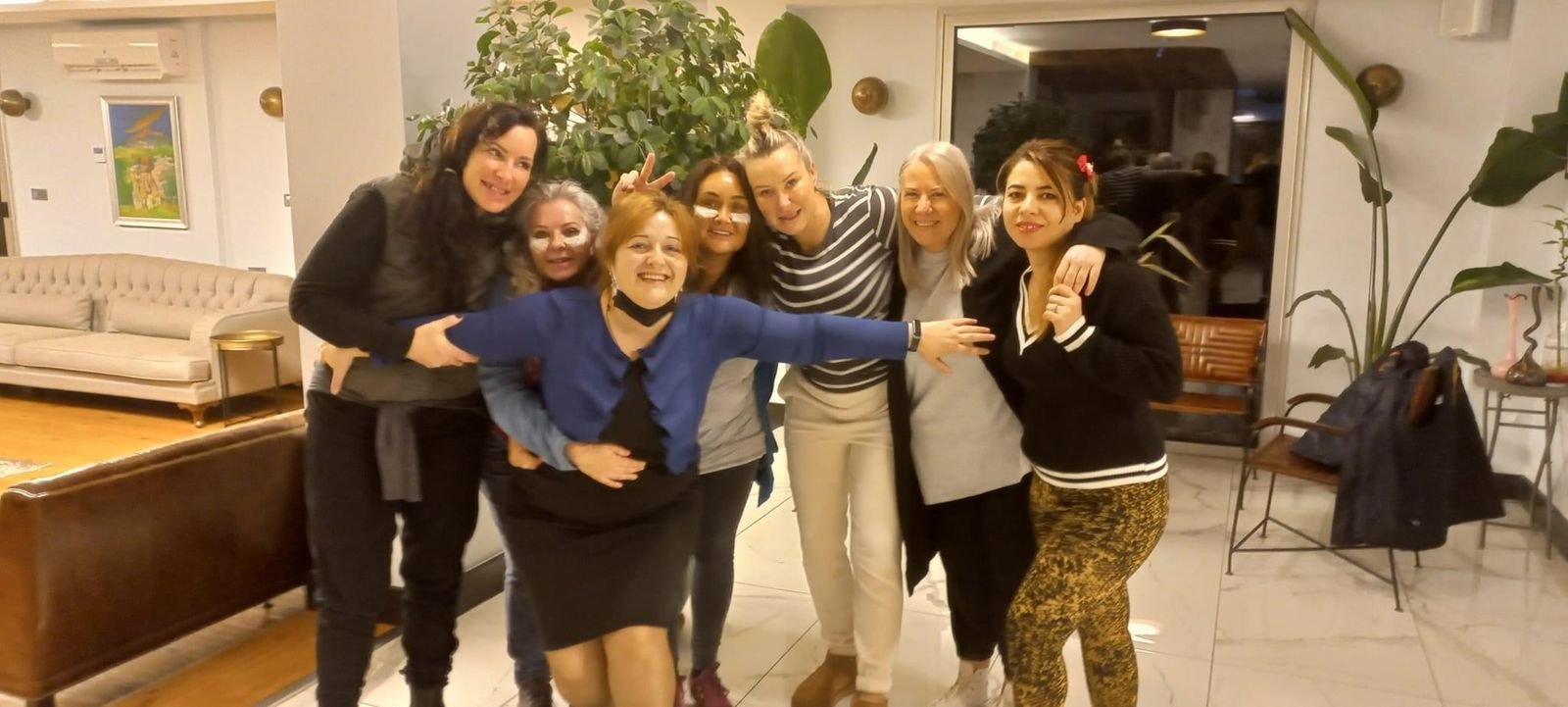 Guests and team members in the living room