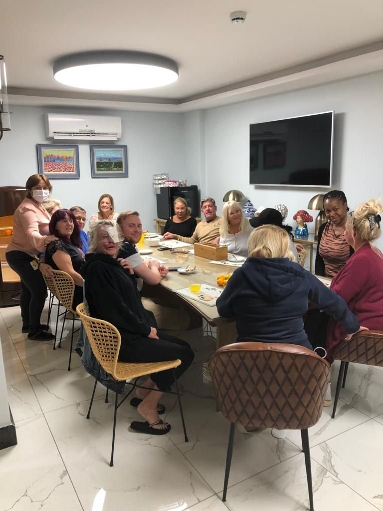 Guests sharing breakfast at the dining table