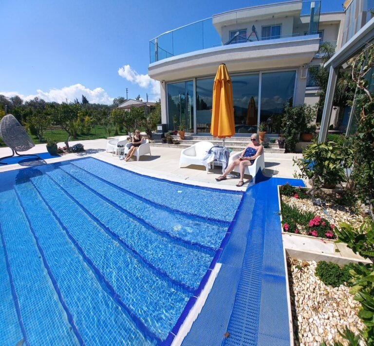 The pool and villa on a sunny day