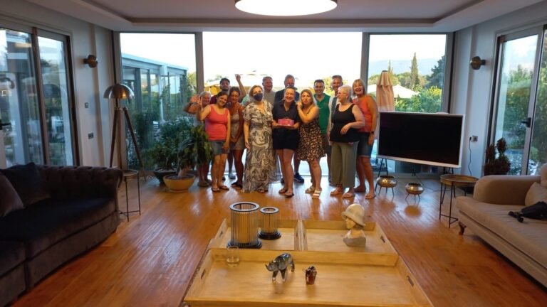 Guests and team gathered in the living room